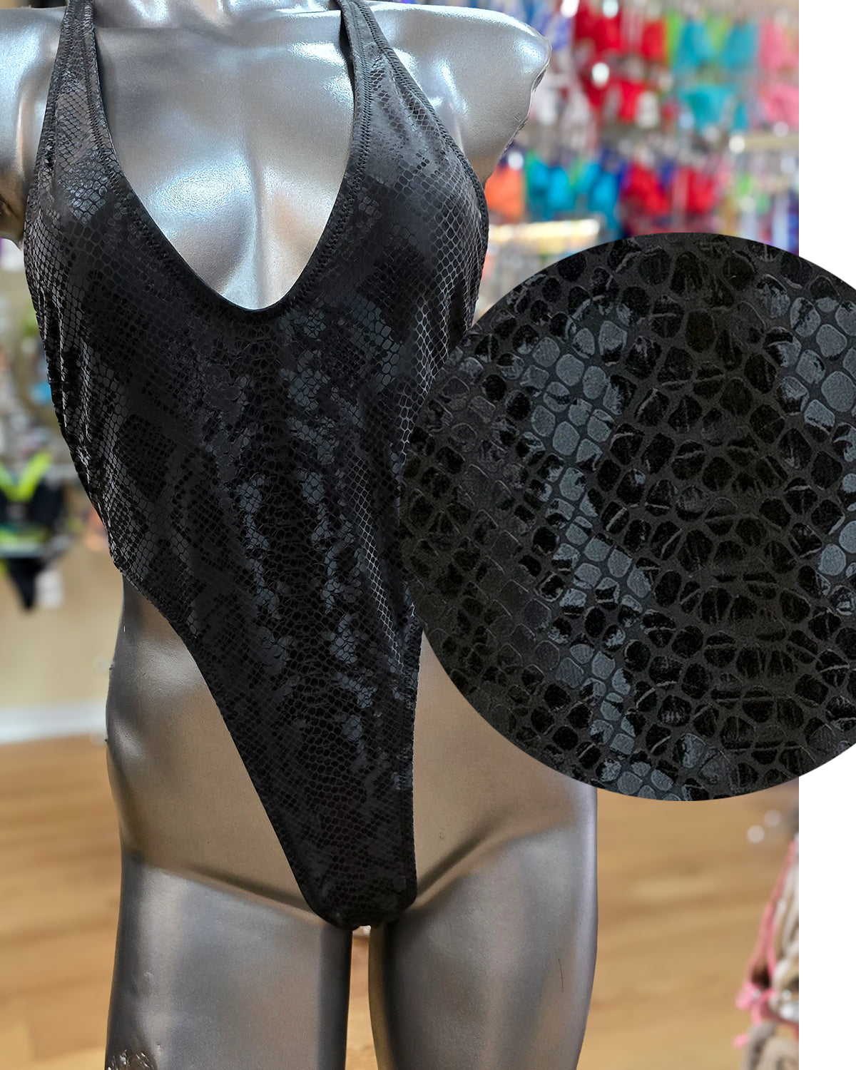 Black snake print one-piece swimsuit racerback thong. Manufactured in Clearwater Florida