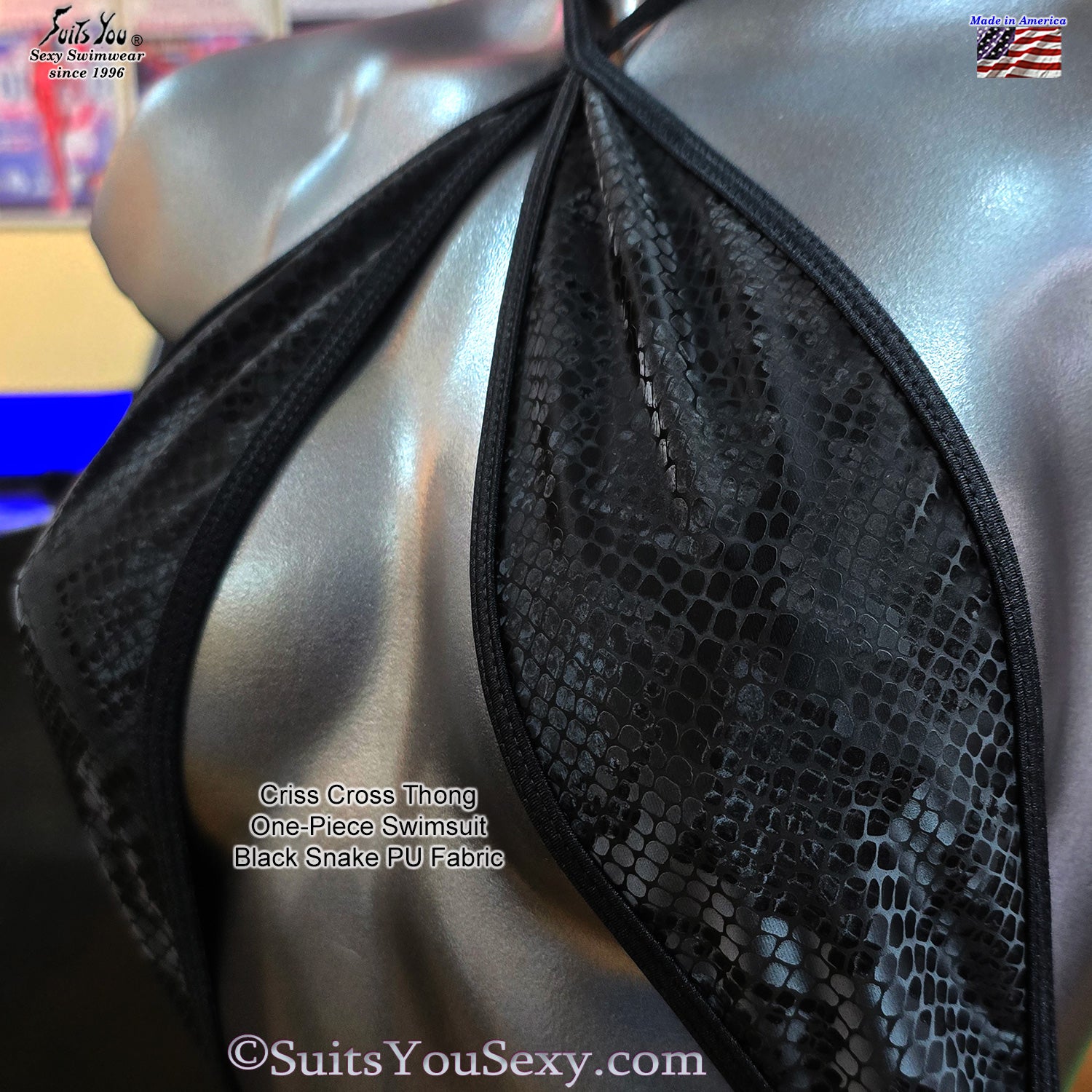 Solid color criss-cross one-piece on model — manufactured in USA