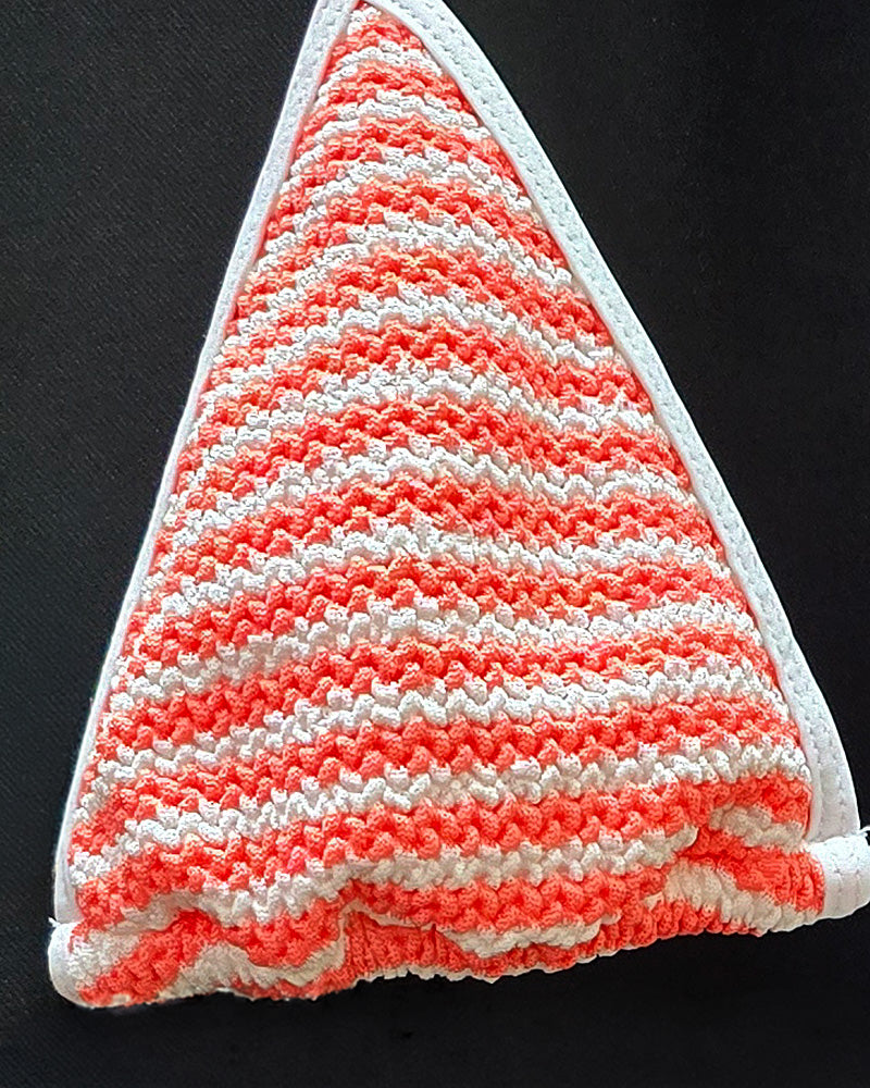 Limited Edition Textured Fabric Swimsuit. Coral and Ivory stripes. Close up view of fabric.